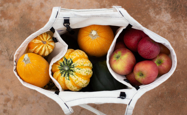 The Organic Cotton Truck in Natural; top-down shot shows that the Truck is packed full of winter squash and apples.